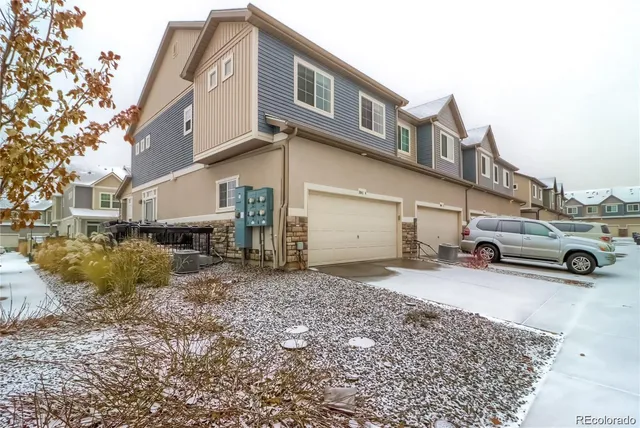 a view of a car park in front of house