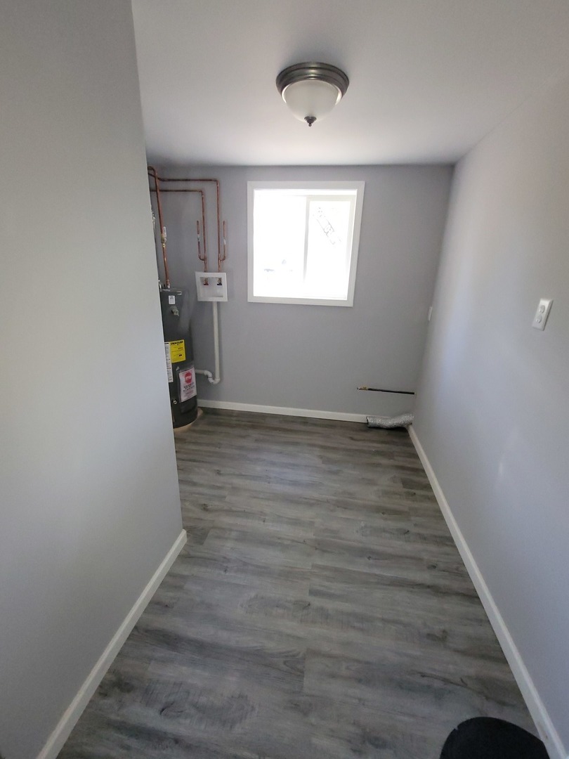 133 Kingston Road Bolingbrook, IL 60440 - Photo 11 of 19 a view of room with window and hardwood floor
