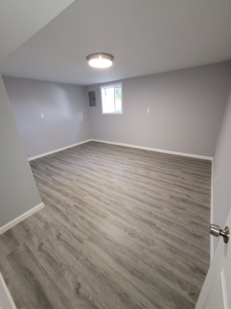 133 Kingston Road Bolingbrook, IL 60440 - Photo 12 of 19 a view of an empty room with a window