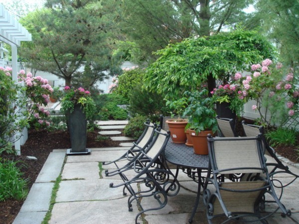 10 Patten Circle Newton, MA 02459 - Photo 22 of 26 a backyard of a house with table and chairs