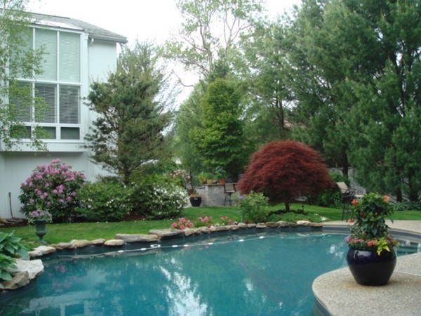 10 Patten Circle Newton, MA 02459 - Photo 24 of 26 a view of a house with a yard and a garden