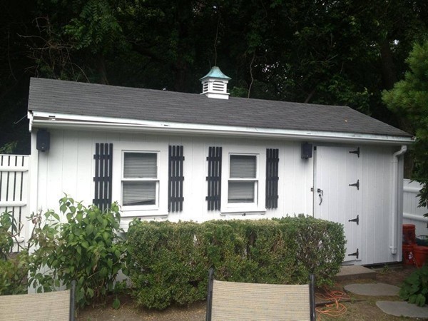10 Patten Circle Newton, MA 02459 - Photo 25 of 26 a front view of a house with a yard