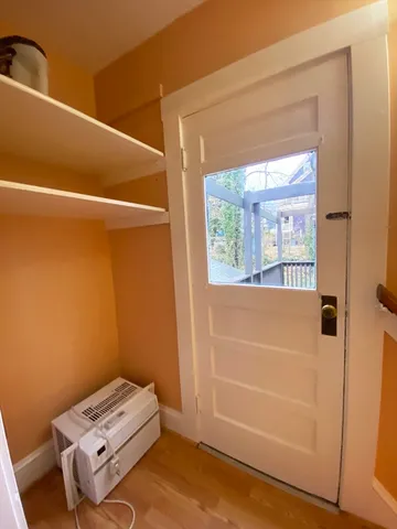 a view of a balcony with wooden floor