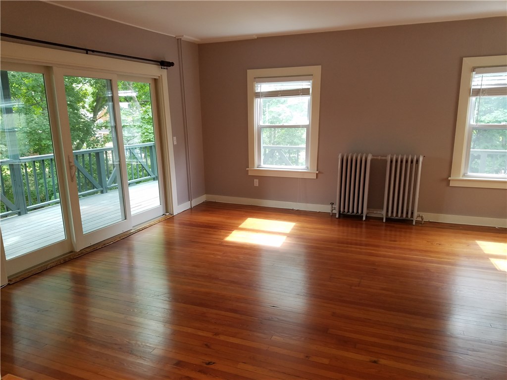 49 Merton Road, Unit 2 Newport, RI 02840 - Photo 13 of 42 Living Room/Dining Area & sliders to wrap around porch