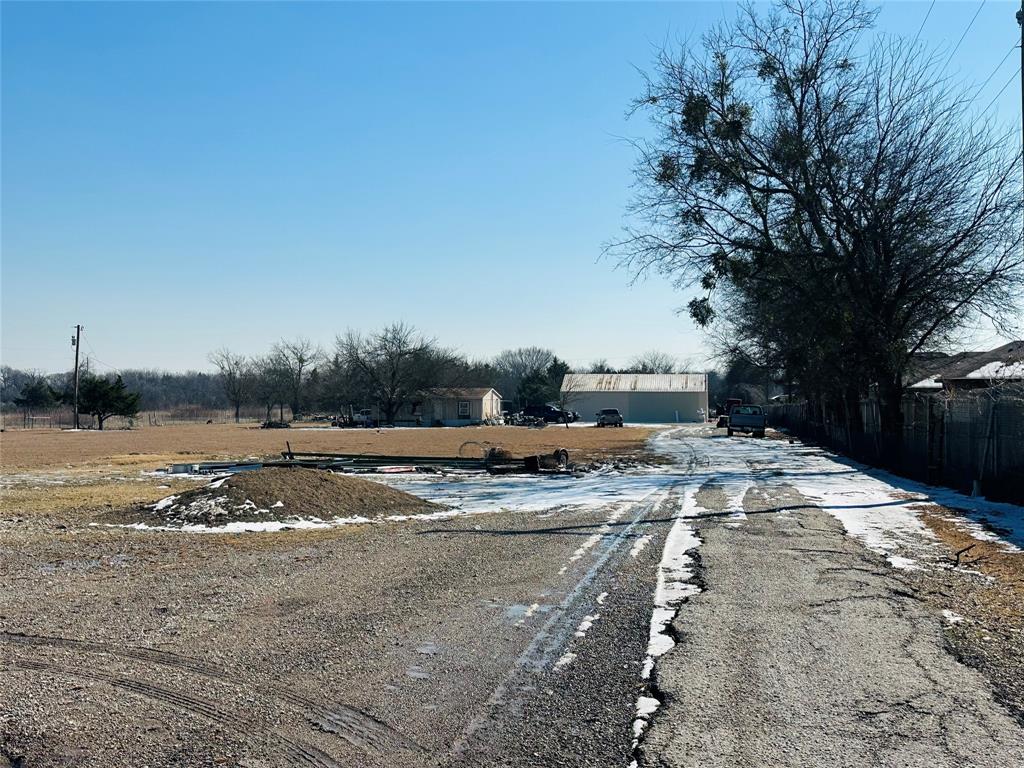 900 East Belt Line Road Wilmer, TX 75172 - Photo 8 of 11 a view of a yard with large trees