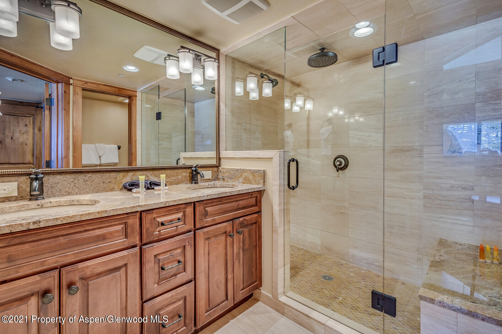 400 Wood Road, Unit 2302 Snowmass Village, CO 81615 - Photo 13 of 16 a bathroom with a shower sink and mirror