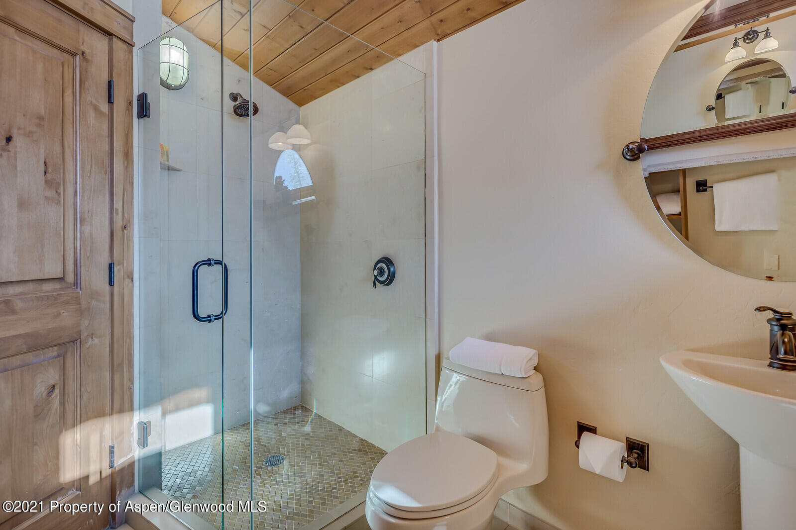 400 Wood Road, Unit 2302 Snowmass Village, CO 81615 - Photo 15 of 16 a white toilet sitting next to a bathroom sink