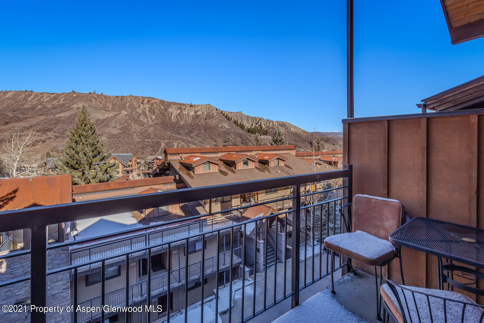 400 Wood Road, Unit 2302 Snowmass Village, CO 81615 - Photo 16 of 16 a view of a balcony with furniture and a mountain view