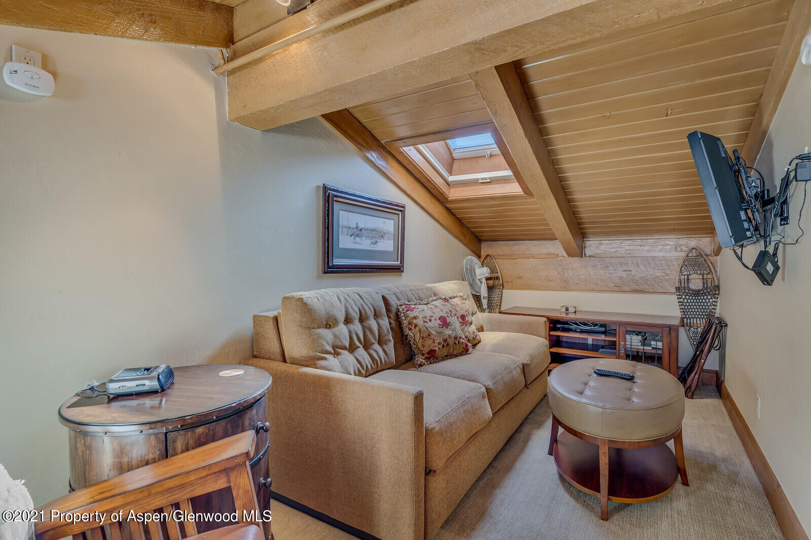 400 Wood Road, Unit 2302 Snowmass Village, CO 81615 - Photo 5 of 16 a living room with furniture and a couch