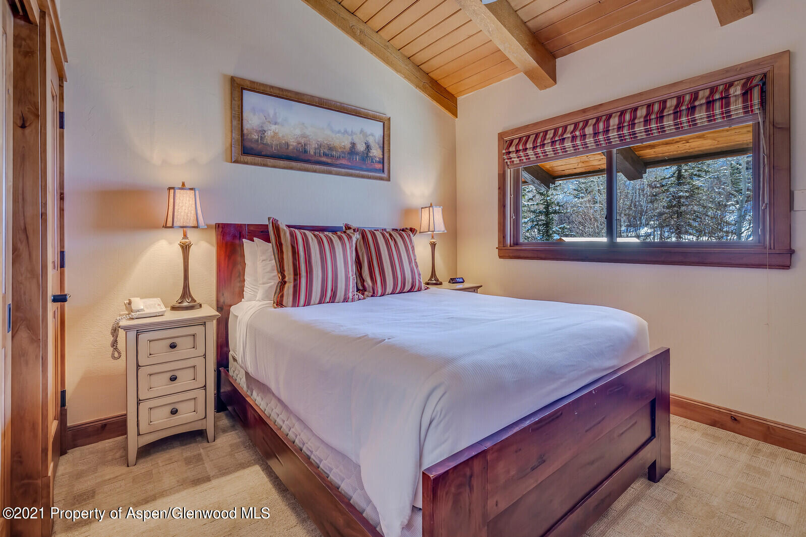400 Wood Road, Unit 2302 Snowmass Village, CO 81615 - Photo 9 of 16 a bedroom with a bed and a painting on the wall
