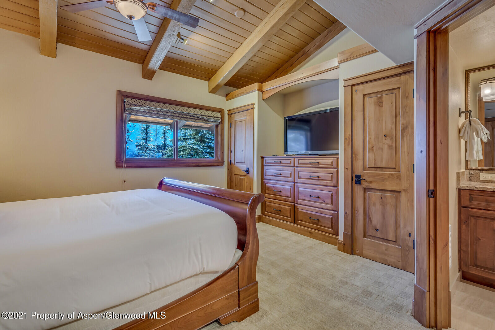 400 Wood Road, Unit 2302 Snowmass Village, CO 81615 - Photo 10 of 16 a bed sitting in a room next to a window