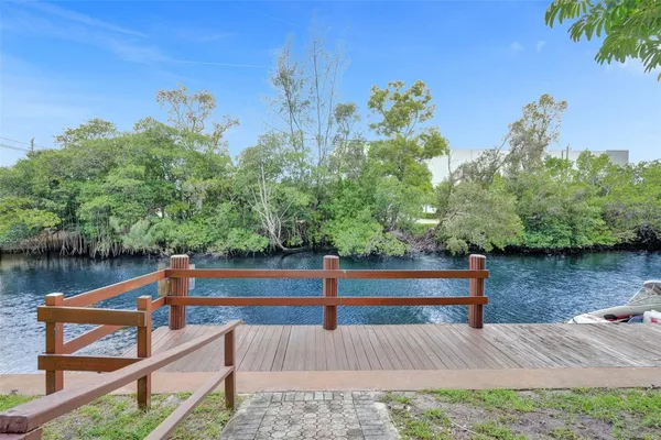 a view of a wooden deck and lake