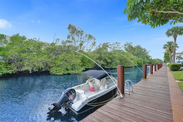 a wooden bench sitting in the middle of a lake