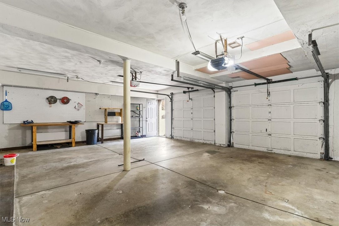 3863 Sourek Rd Extension Akron, OH 44333 - Photo 34 of 42 Garage featuring a garage door opener