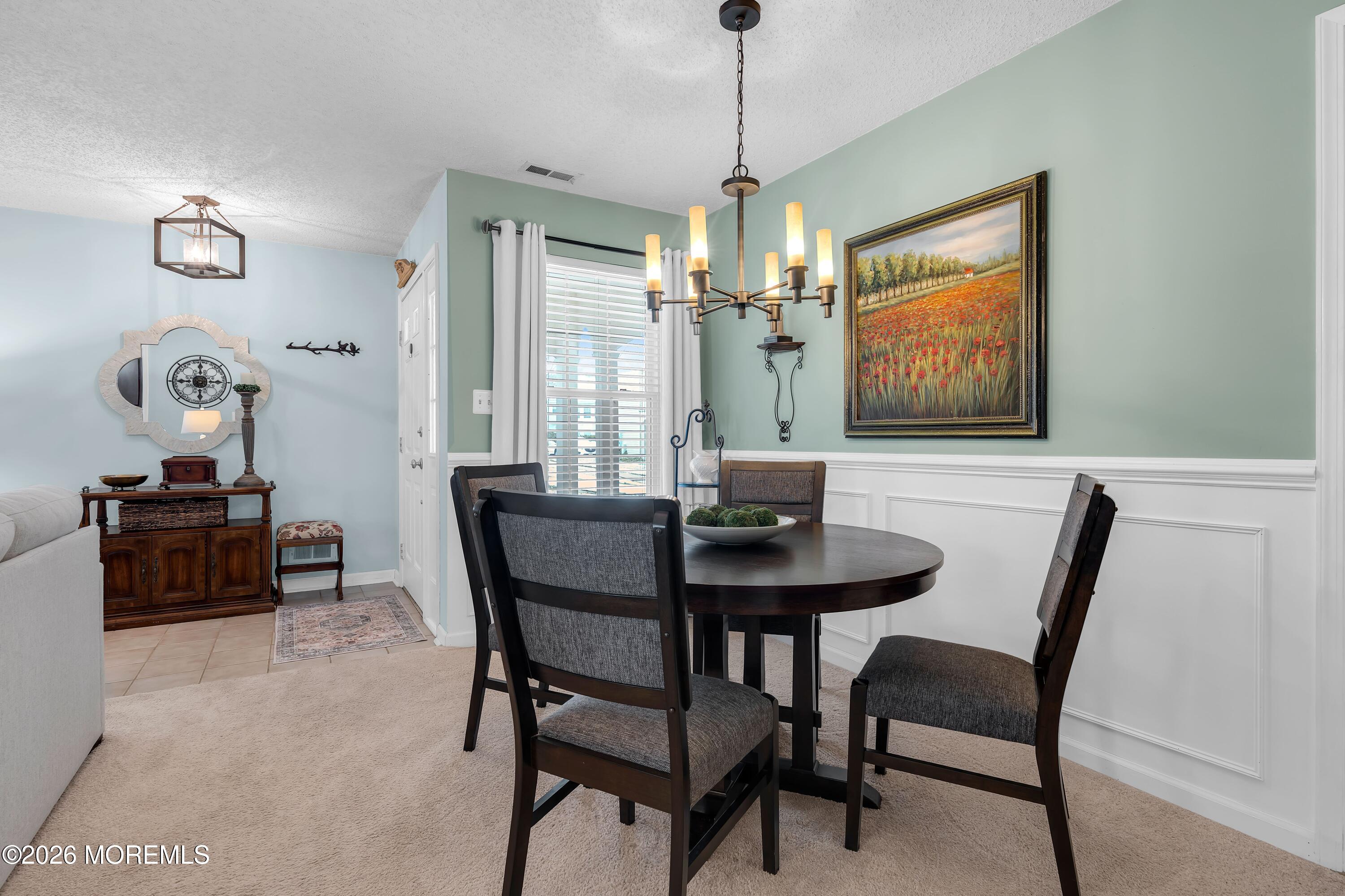 129 Tulip Lane Freehold, NJ 07728 - Photo 18 of 25 a view of a dining room with furniture window and wooden floor