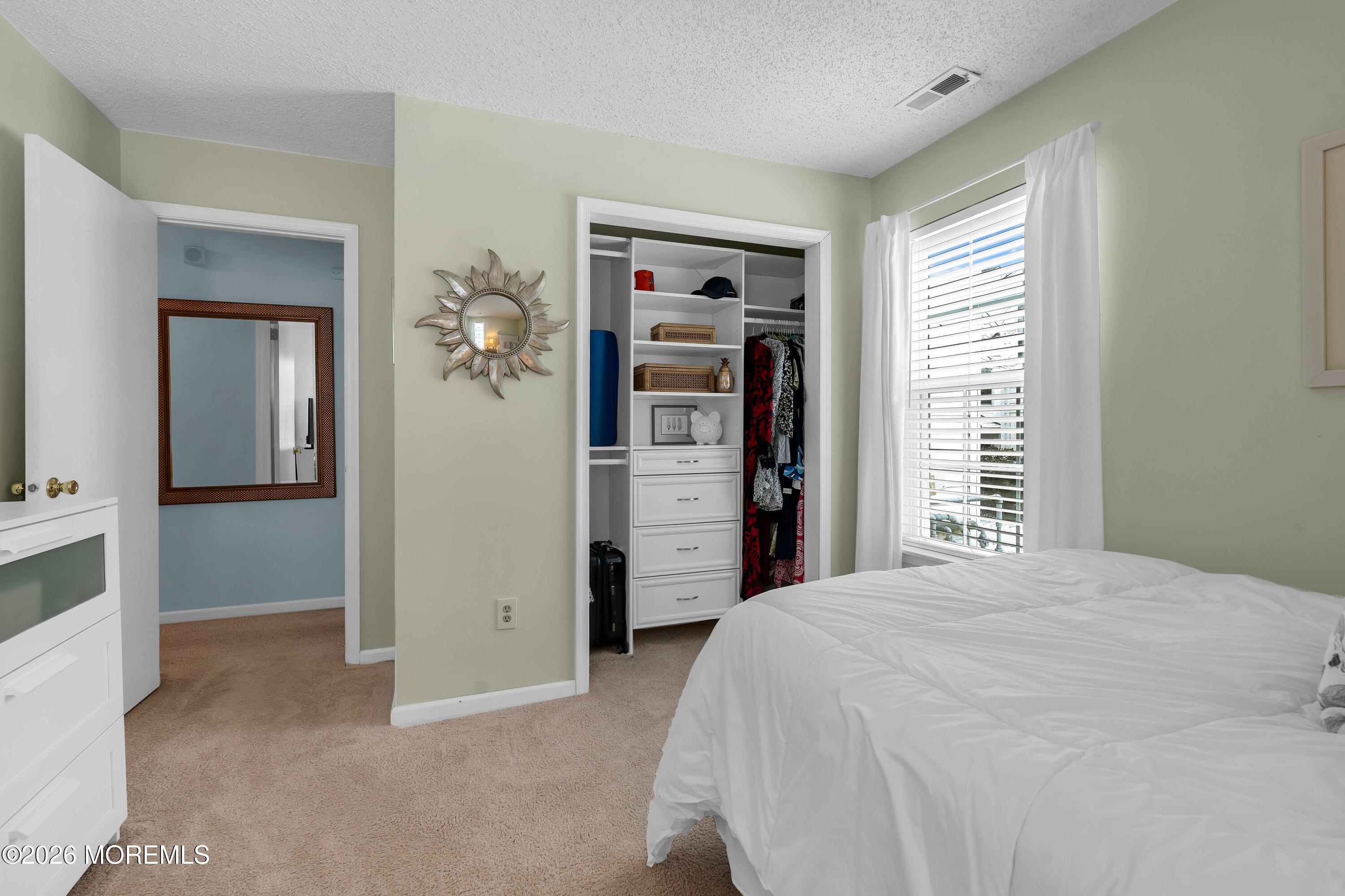 129 Tulip Lane Freehold, NJ 07728 - Photo 20 of 25 a bedroom with a bed and a window