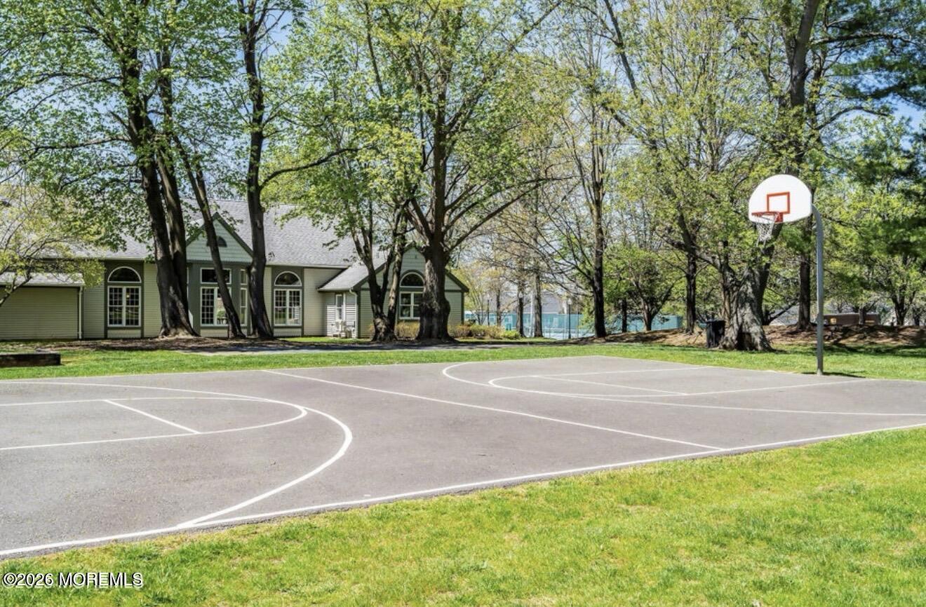 129 Tulip Lane Freehold, NJ 07728 - Photo 22 of 25 a view of a playground with basketball court