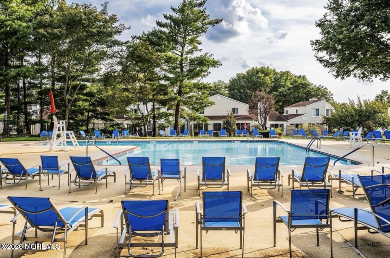 129 Tulip Lane Freehold, NJ 07728 - Photo 3 of 25 a view of swimming pool with outdoor seating