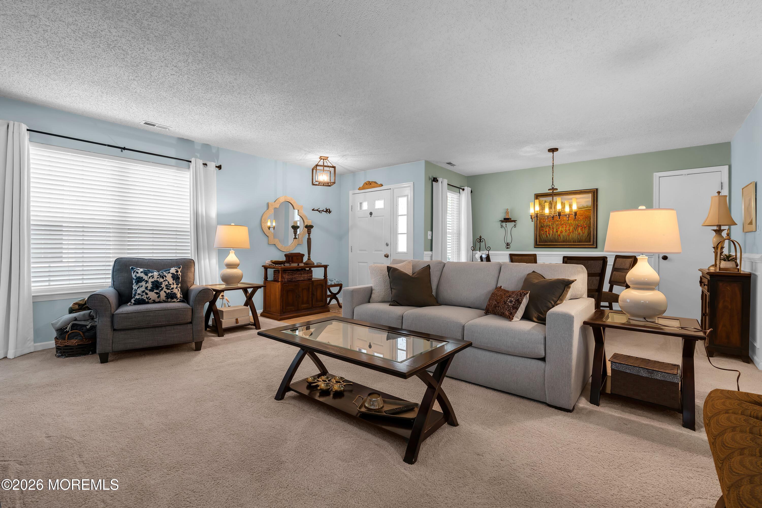 129 Tulip Lane Freehold, NJ 07728 - Photo 5 of 25 a living room with furniture and a large window