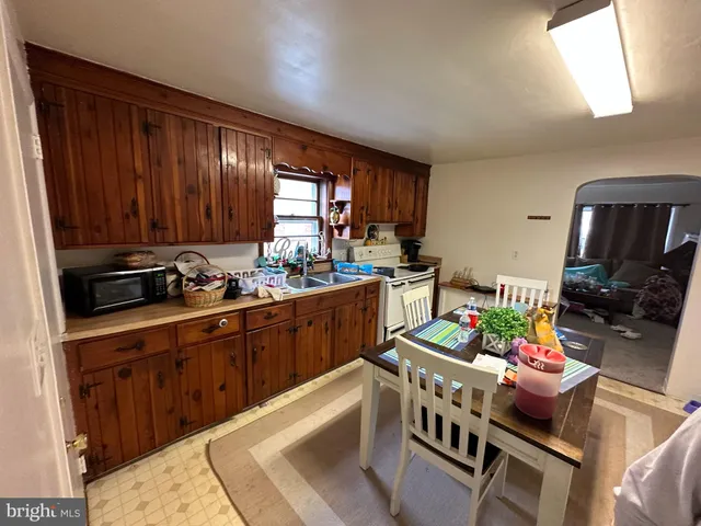 a refrigerator freezer sitting inside of a kitchen
