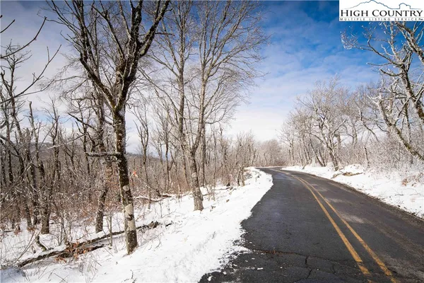 a view of a yard covered with snow