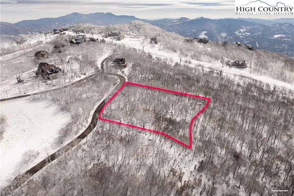 a view of a dry yard with mountain