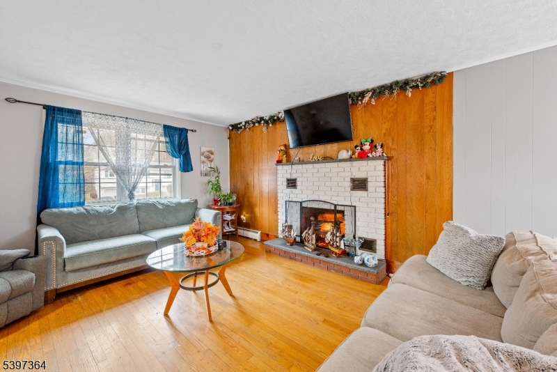21 Laurie Road Landing, NJ 07850 - Photo 2 of 14 a living room with furniture and a fireplace