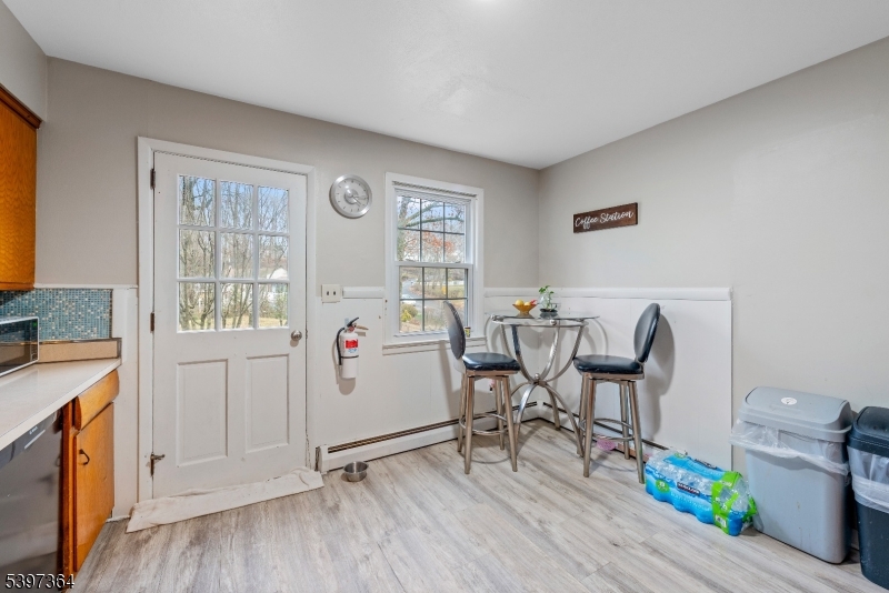 21 Laurie Road Landing, NJ 07850 - Photo 4 of 14 a view of a kitchen with fridge and wooden floor