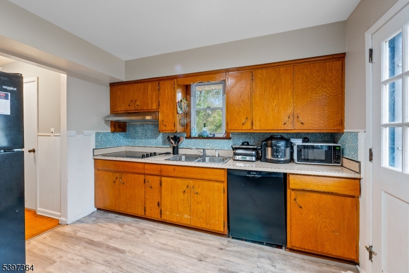 21 Laurie Road Landing, NJ 07850 - Photo 5 of 14 a kitchen with stainless steel appliances granite countertop a sink a stove and a refrigerator