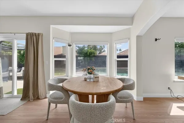 a living room with furniture and a baby crib