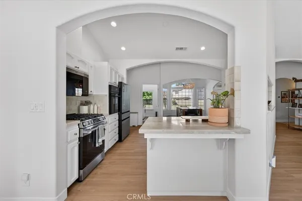 a white bath tub sitting next to a shower