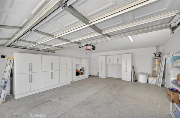a view of an house with backyard and a tub