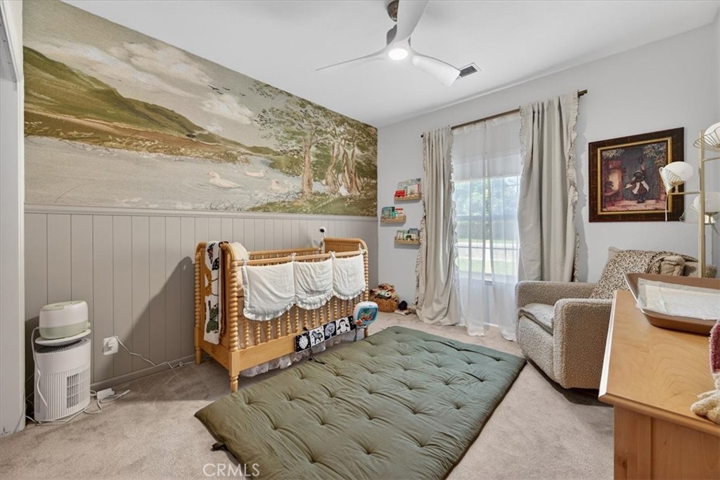 1555 Taylor Street Madera, CA 93637 - Photo 44 of 75 a bed room with a bed and a couch