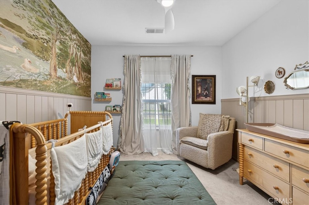 1555 Taylor Street Madera, CA 93637 - Photo 45 of 75 a living room with furniture and a baby crib