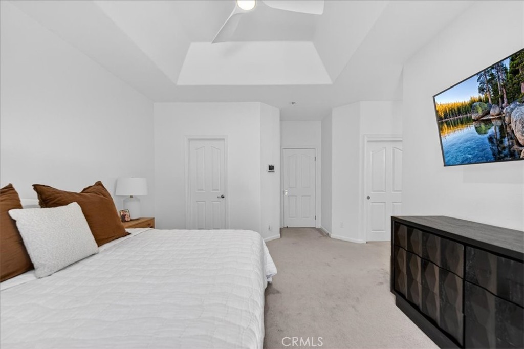 1555 Taylor Street Madera, CA 93637 - Photo 53 of 75 a bedroom with a bed and painting on the wall