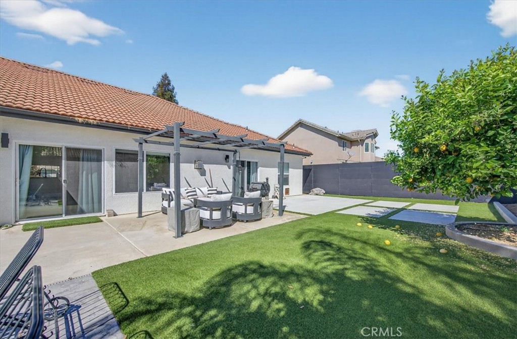 1555 Taylor Street Madera, CA 93637 - Photo 60 of 75 a view of a house with a yard porch and sitting area