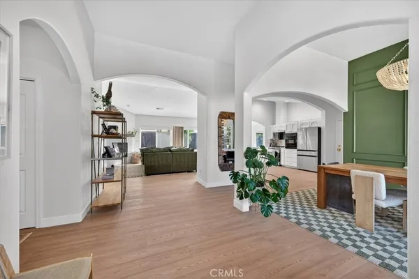 a view of an entryway with wooden floor