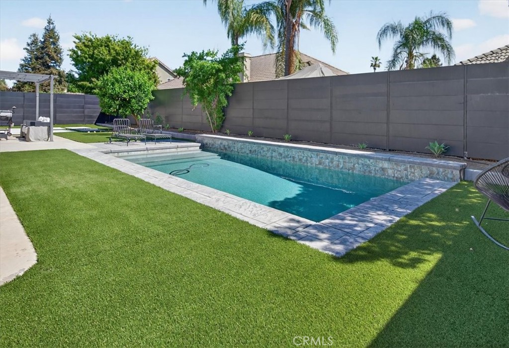 1555 Taylor Street Madera, CA 93637 - Photo 62 of 75 a view of a backyard with plants