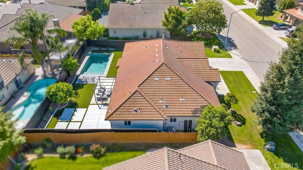 1555 Taylor Street Madera, CA 93637 - Photo 73 of 75 an aerial view of a house with garden space and street view