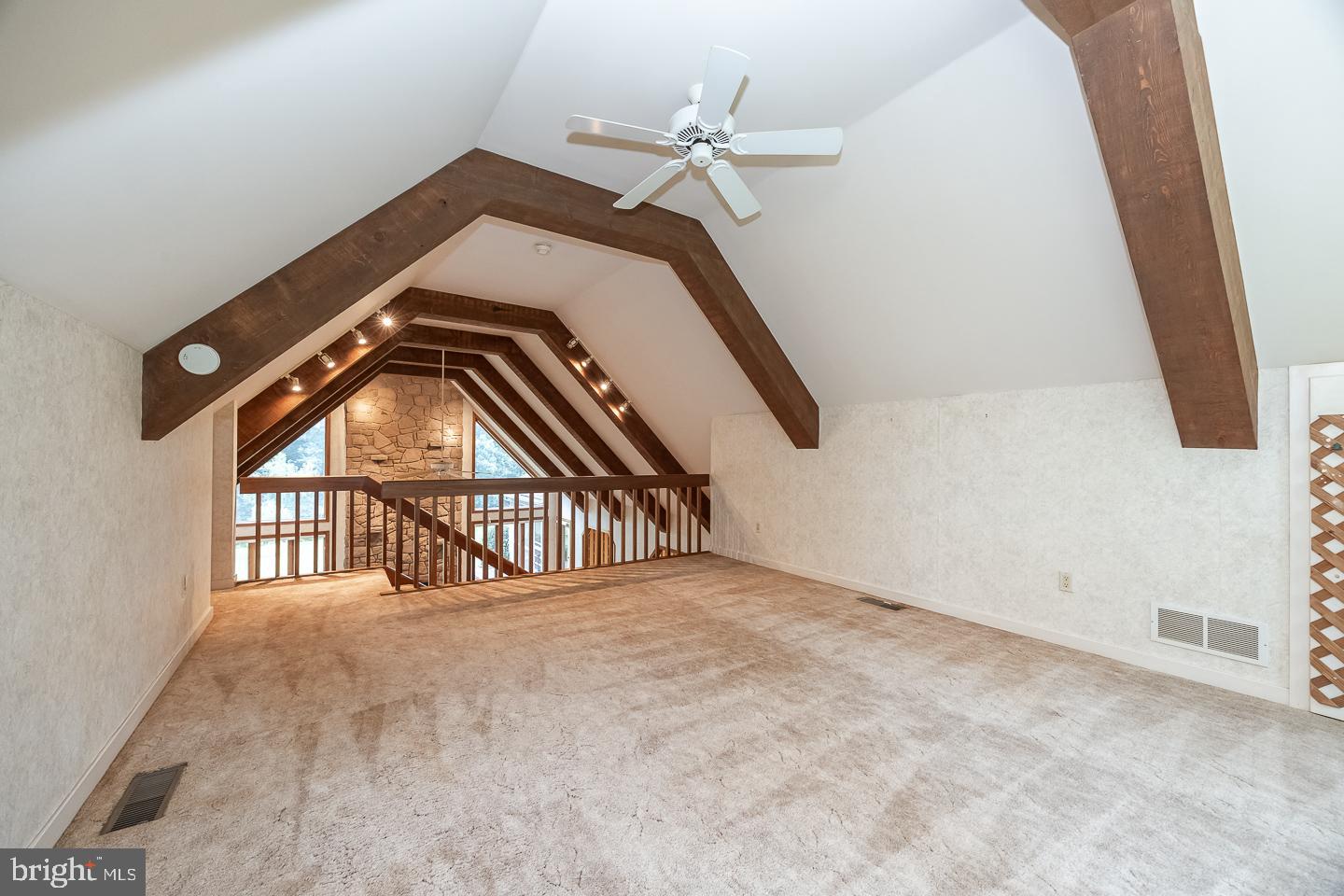 841 Cadmus Road Pottstown, PA 19465 - Photo 15 of 58 an empty room with a ceiling fan and windows