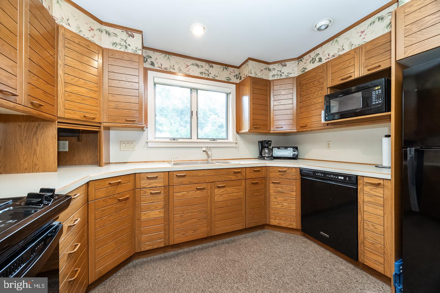 841 Cadmus Road Pottstown, PA 19465 - Photo 18 of 58 a kitchen with stainless steel appliances granite countertop a stove a sink and a microwave