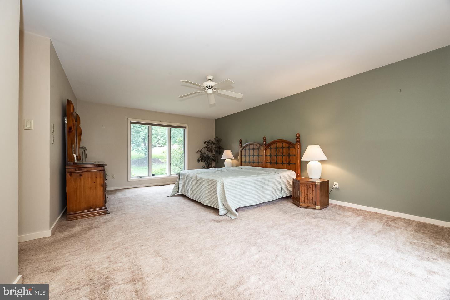 841 Cadmus Road Pottstown, PA 19465 - Photo 29 of 58 a spacious bedroom with a bed and a chandelier