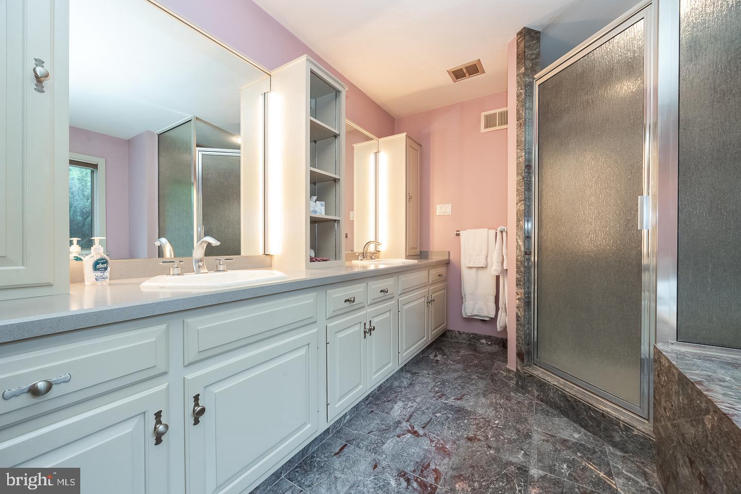 841 Cadmus Road Pottstown, PA 19465 - Photo 31 of 58 a spacious bathroom with a shower sink and mirror