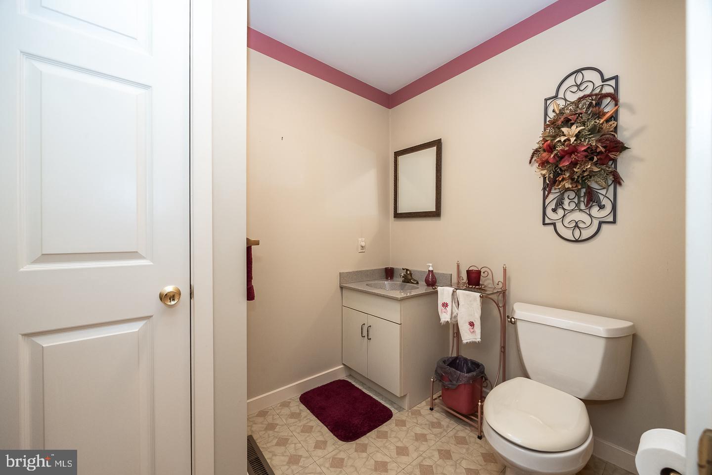 841 Cadmus Road Pottstown, PA 19465 - Photo 39 of 58 a bathroom with a toilet and a shower curtain