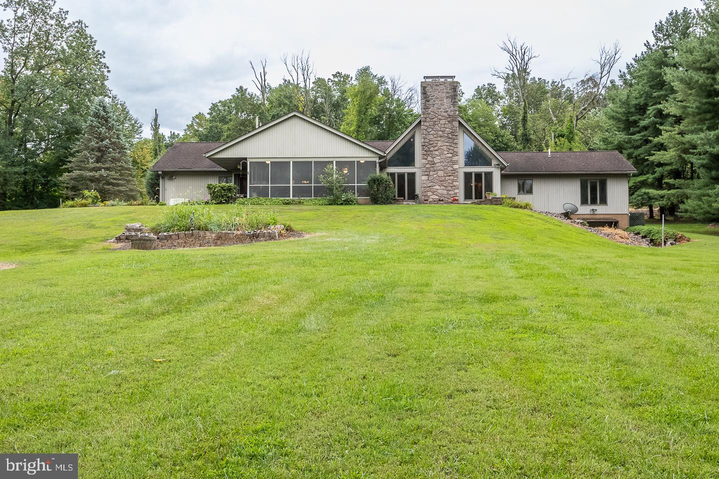 841 Cadmus Road Pottstown, PA 19465 - Photo 40 of 58 a house view with a garden space