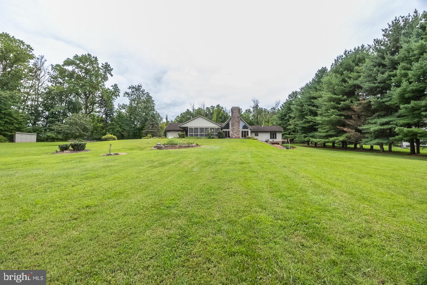 841 Cadmus Road Pottstown, PA 19465 - Photo 58 of 58 a view of a green field with trees in the background