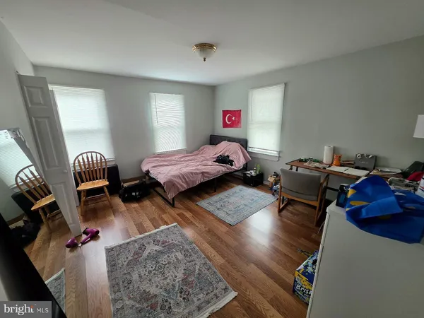 a bed room with furniture and a window