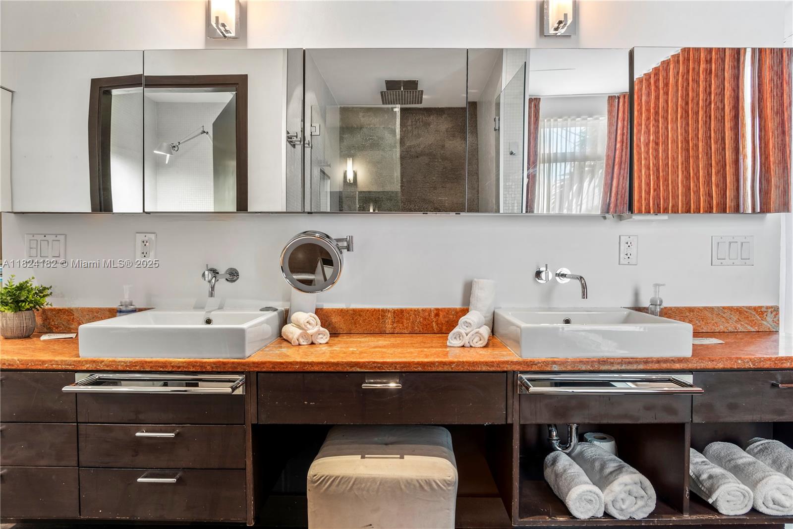 1606 South Bayshore Drive Miami, FL 33133 - Photo 26 of 54 a bathroom with a sink and a mirror