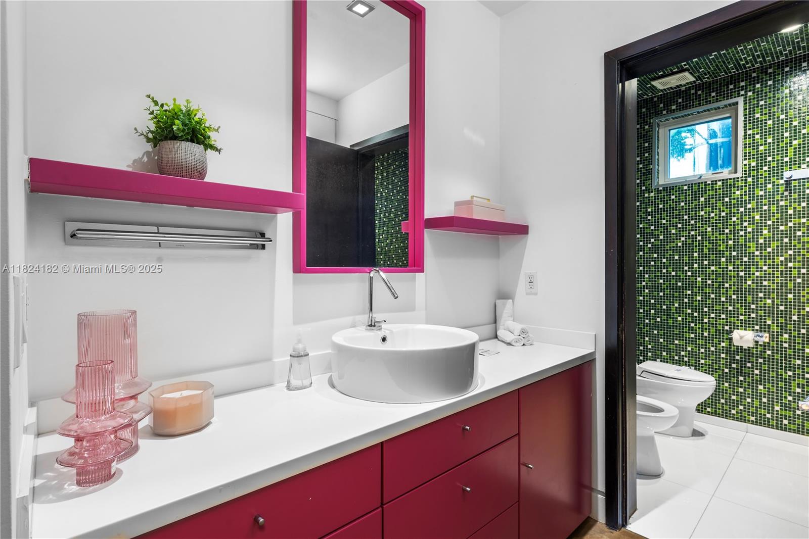 1606 South Bayshore Drive Miami, FL 33133 - Photo 30 of 54 a bathroom with a sink and a mirror