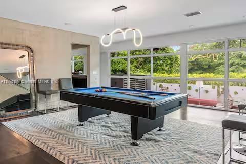 1606 South Bayshore Drive Miami, FL 33133 - Photo 3 of 54 a living room with furniture a large window and a table